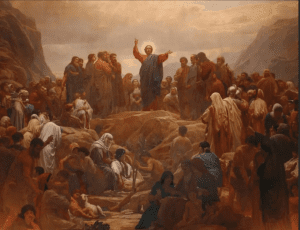 Jesus standing on a hill, surrounded by a multitude